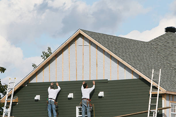 Professional Storm Damage Siding Repair technician working in Wellsburg, WV